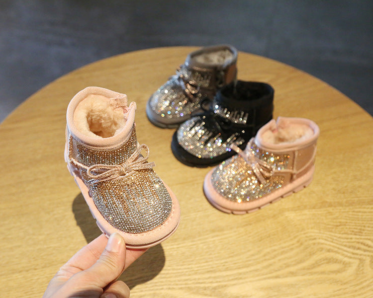 Bota infantil con lazo brillante