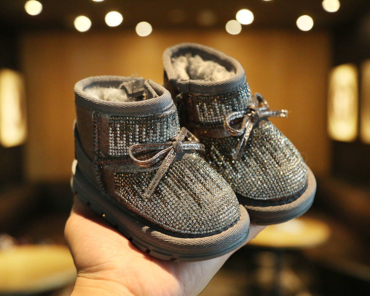 Bota infantil con lazo brillante