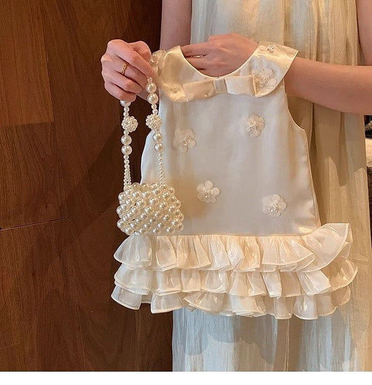 Vestido infantil con lazo y flores