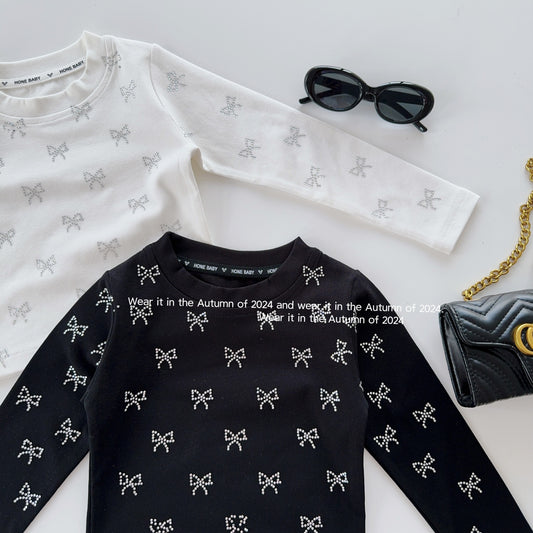 Blusa infantil para niña con lazos brillantes