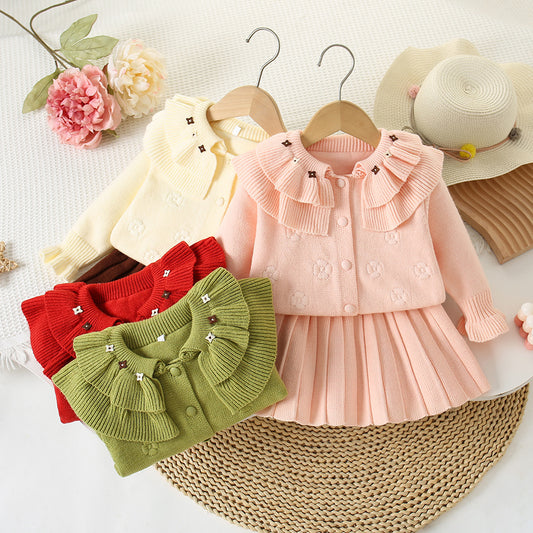 Conjunto de punto con flores para niña
