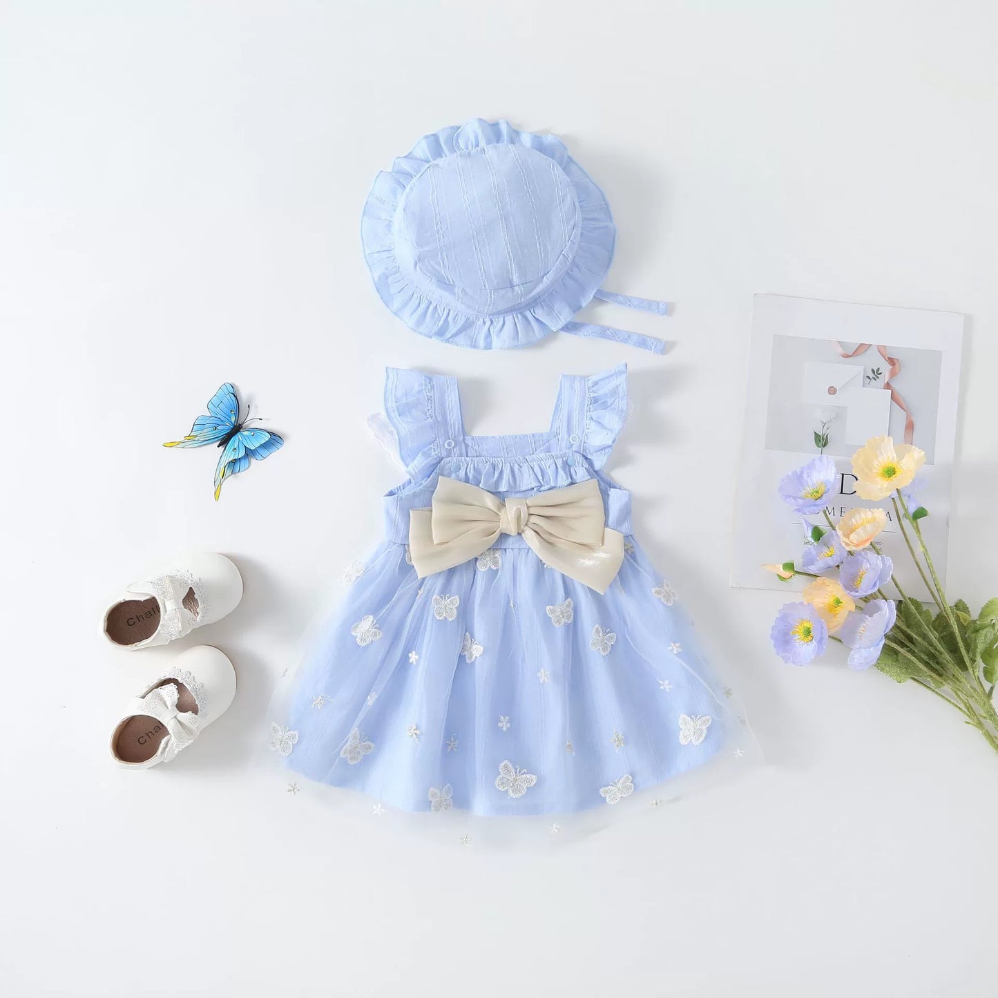 Vestido infantil con mariposas y lazo