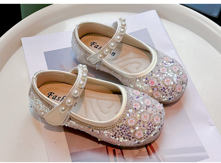 Zapatos de niña con flores brillantes