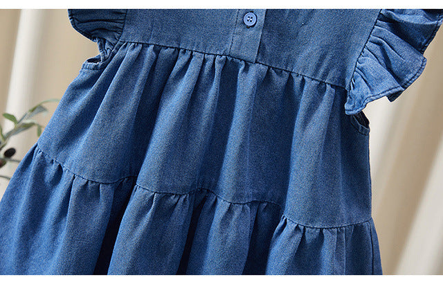 Vestido vaquero con lazo para niña