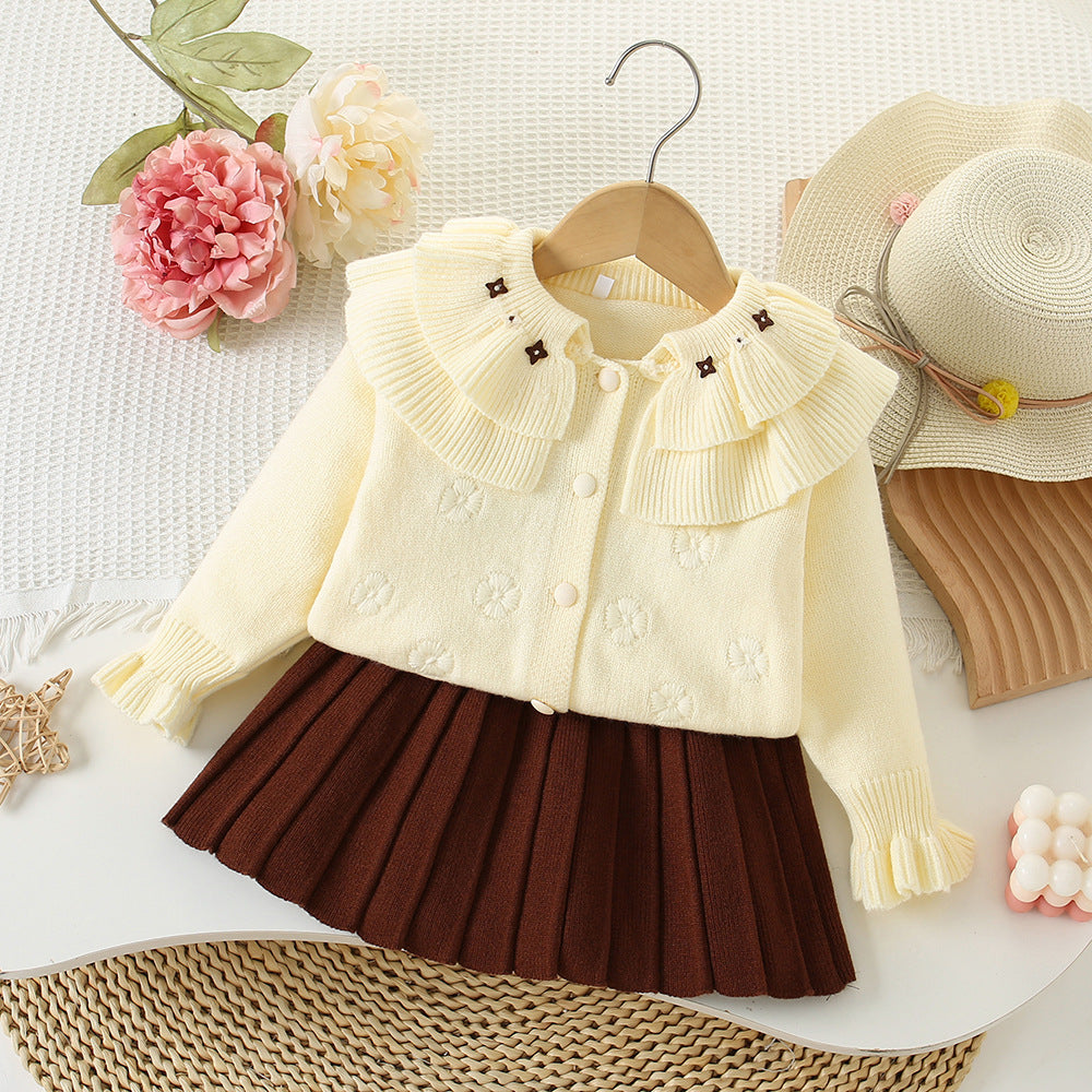 Conjunto de punto con flores para niña