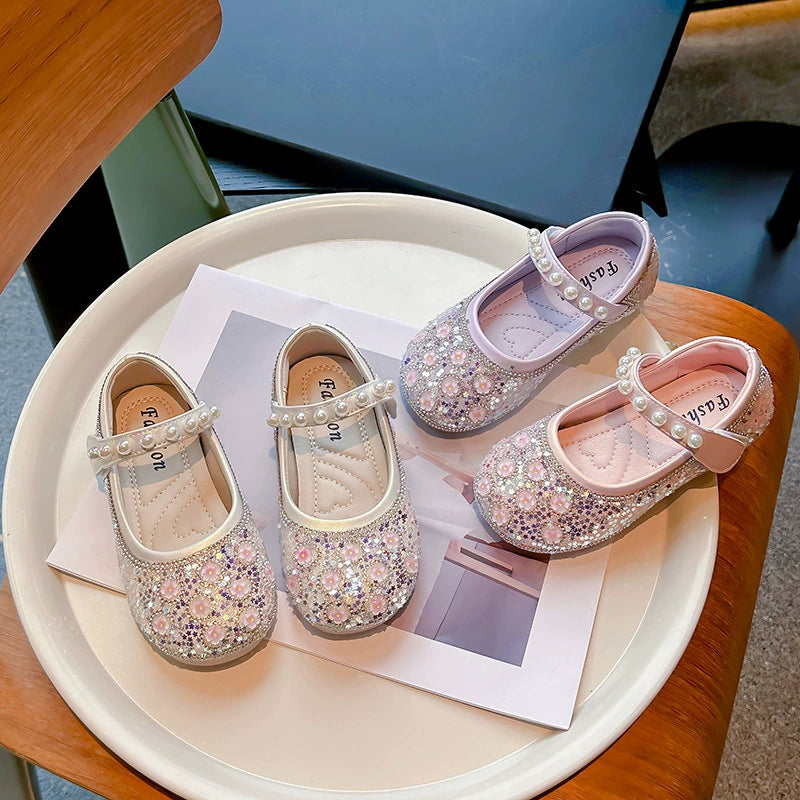 Zapatos de niña con flores brillantes