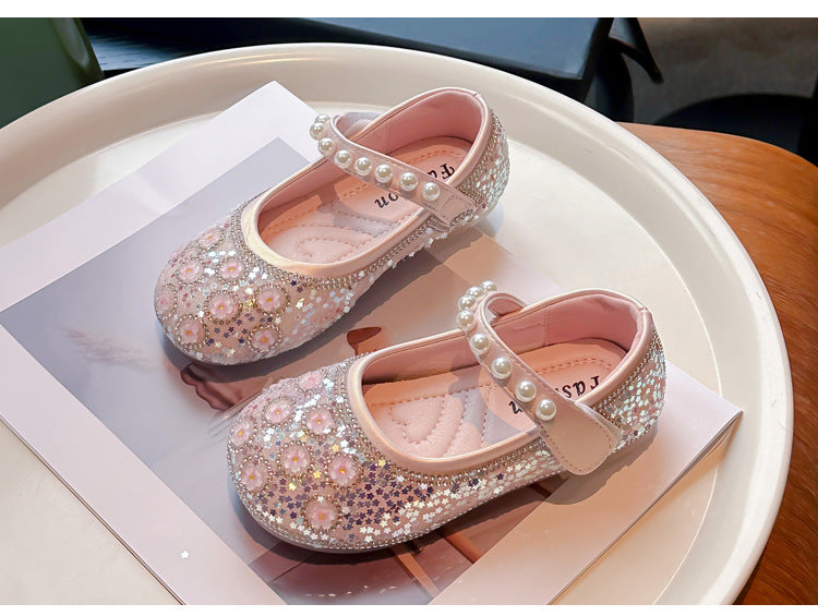 Zapatos de niña con flores brillantes