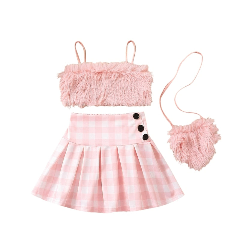 Conjunto infantil femenino de felpa y falda de ajedrez.