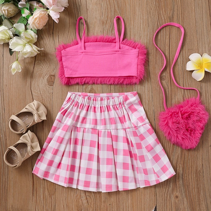 Conjunto infantil femenino de felpa y falda de ajedrez.
