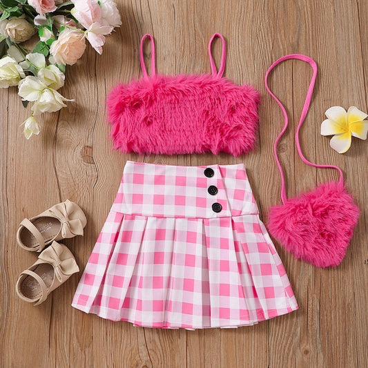 Conjunto infantil femenino de felpa y falda de ajedrez.