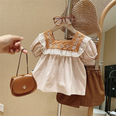 Vestido infantil con volantes bordados