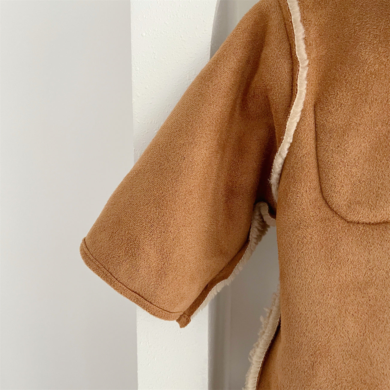 Mono Infantil Peludo Bolsinho