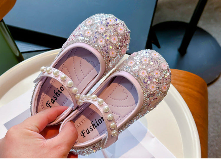 Zapatos de niña con flores brillantes