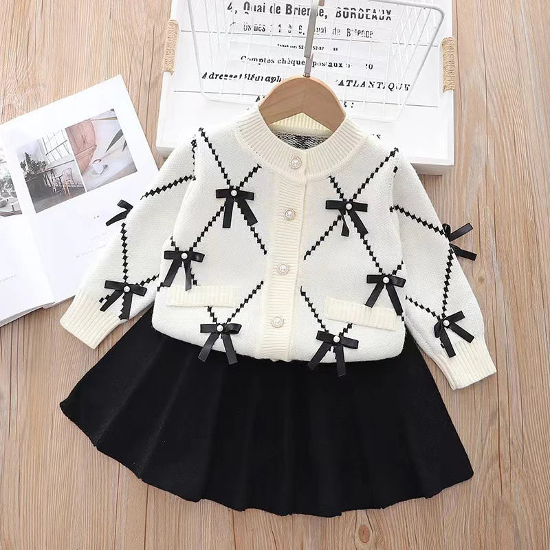 Conjunto de punto para niñas con lazos