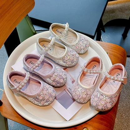 Zapatos de niña con flores brillantes