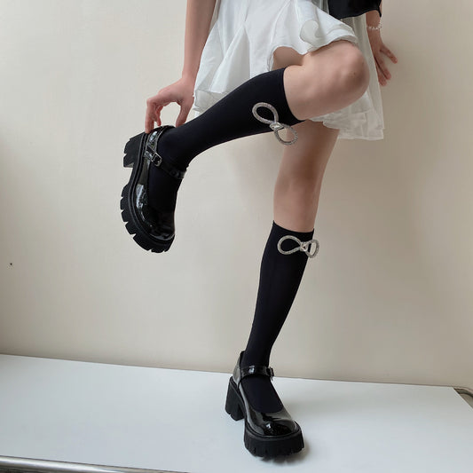Calcetines infantiles con lazo brillante