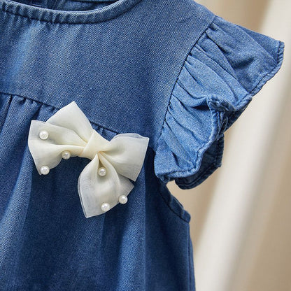Vestido vaquero con lazo para niña