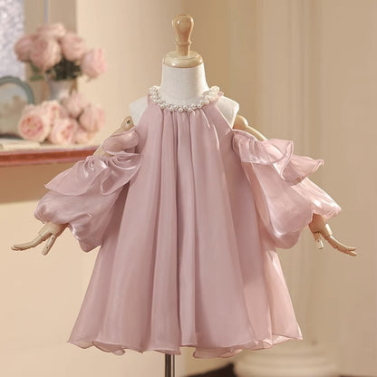 Vestido infantil abullonado con perlas