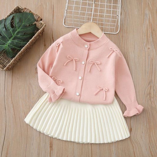 Conjunto de punto para niñas con lazos