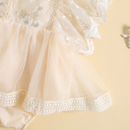 Vestido mameluco, tul con flores bordadas y mangas volantes