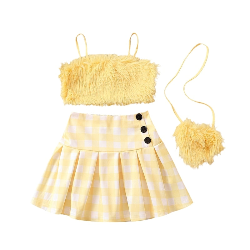 Conjunto infantil femenino de felpa y falda de ajedrez.