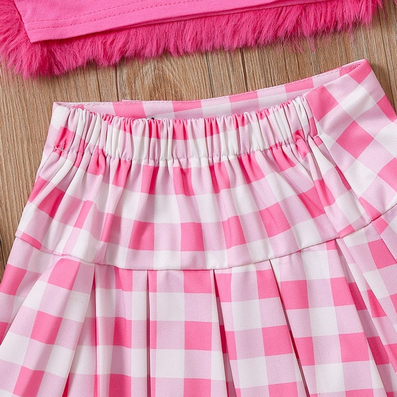 Conjunto infantil femenino de felpa y falda de ajedrez.