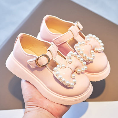 Zapatos de perlas con lazo